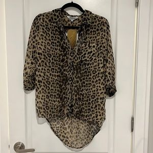 Leopard print blouse. Mesh/see through. Quarter sleeves. Small open back cutout.